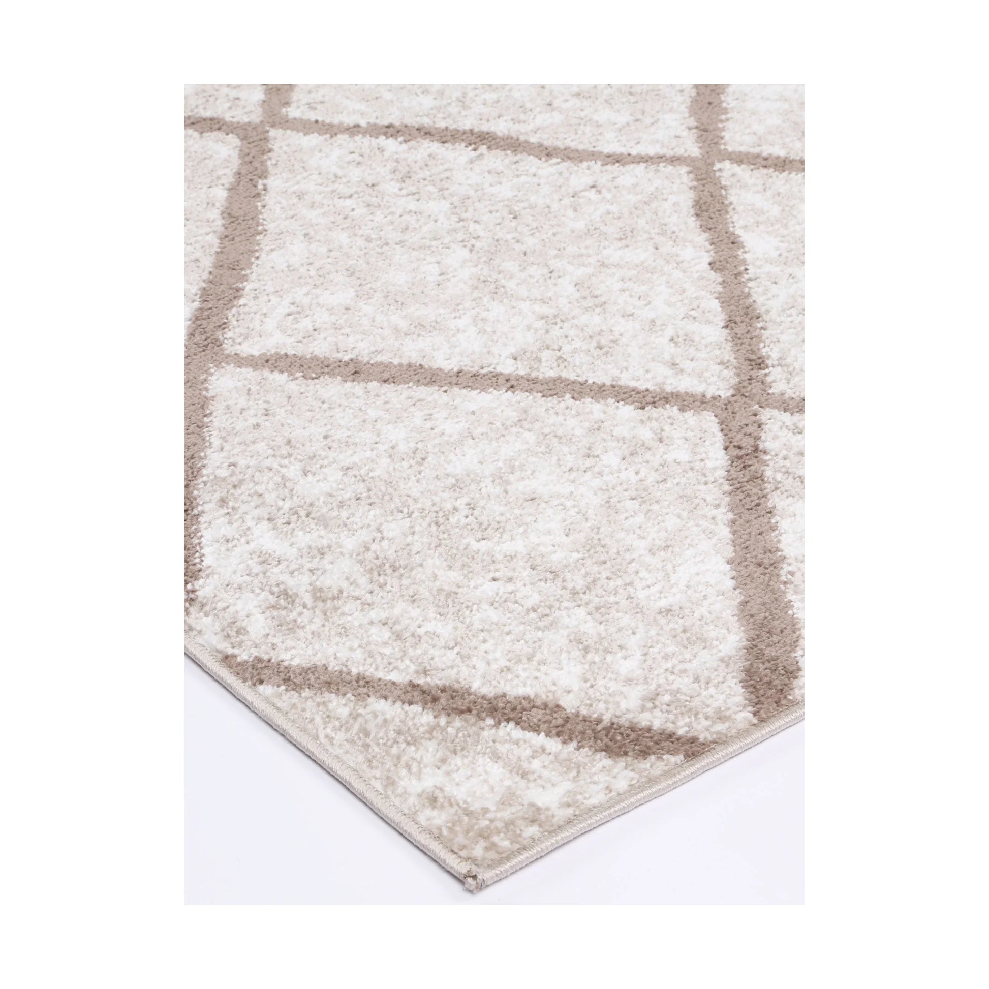 Corner detail of Kimberley 1 Trellis Latte rug showing bound edge, textured pile and modern lattice design, 230 x 160 cm