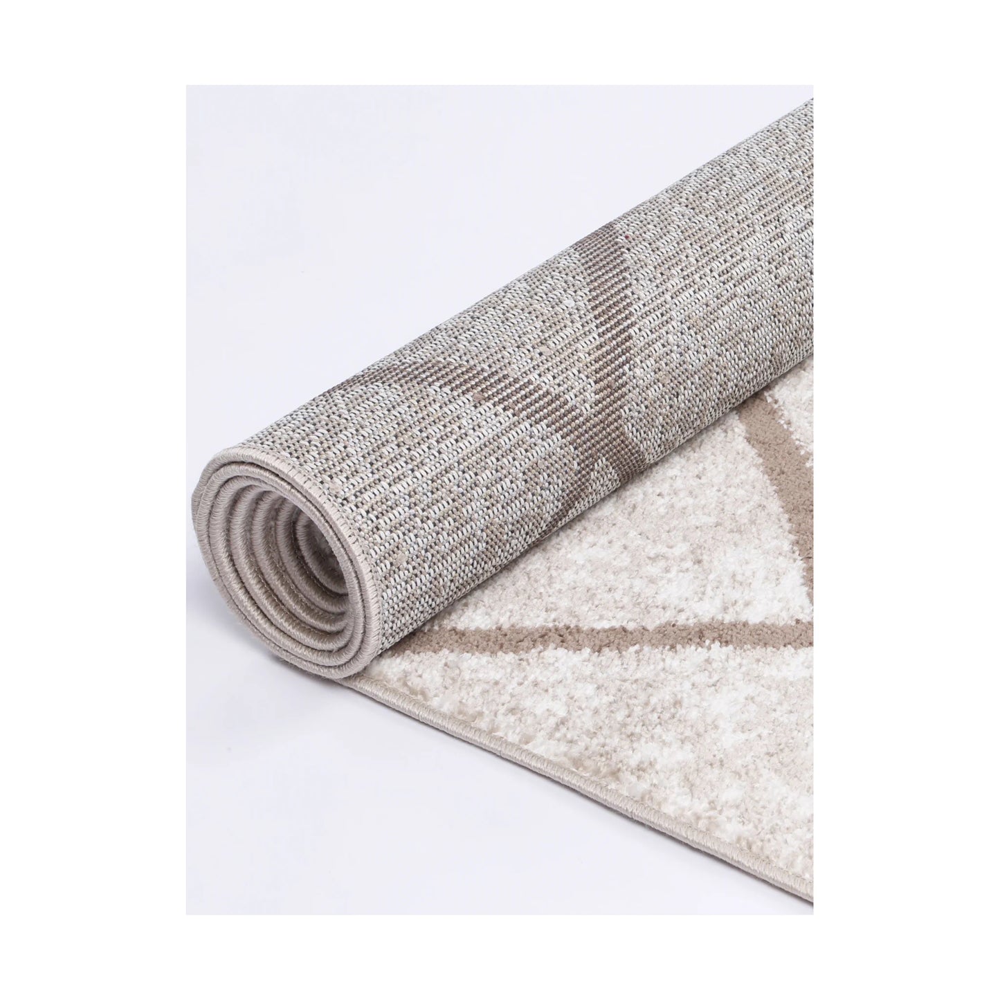 Rolled edge detail of Kimberley 1 Trellis Latte rug showing backing, binding and patterned heatset polypropylene pile, 230 x 160 cm