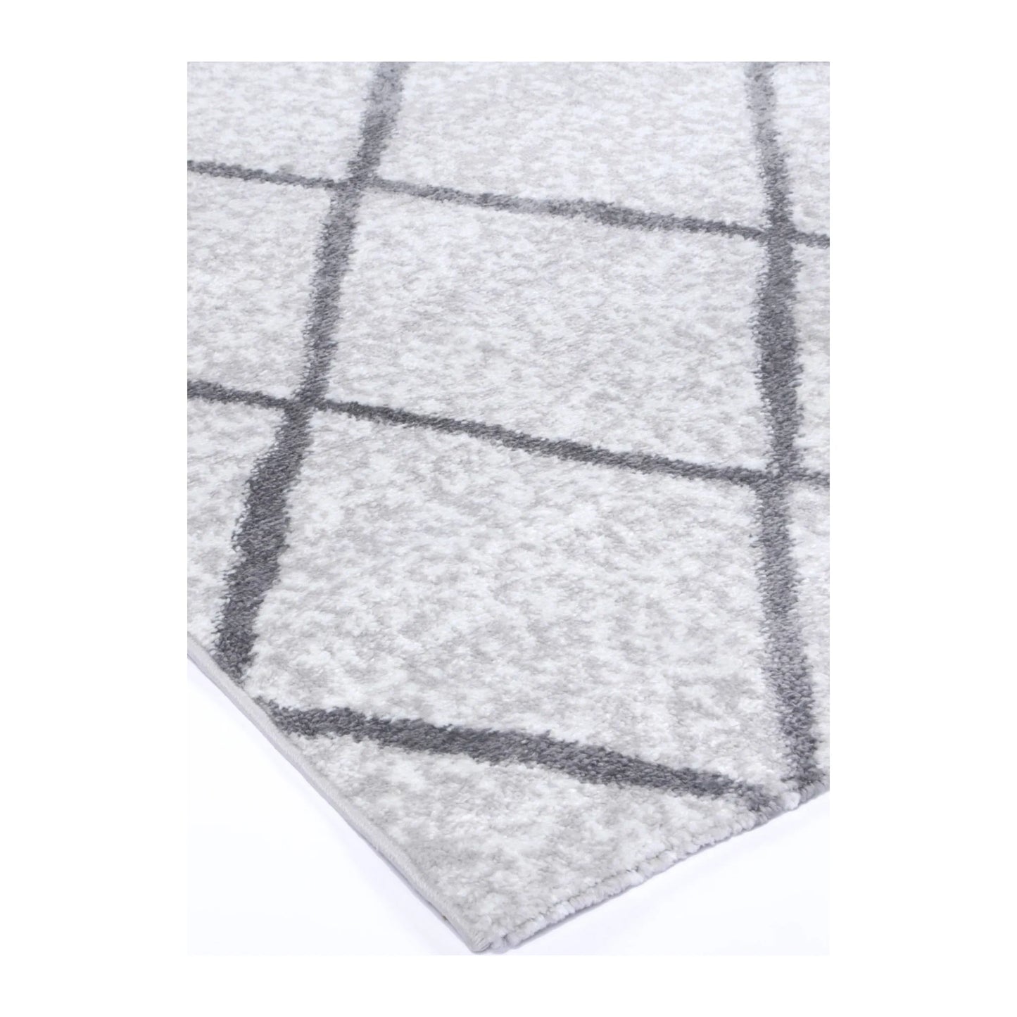 Corner detail of Kimberley 1 Trellis Silver rug showing bound edge, pile texture and diamond pattern, 290 x 200 cm