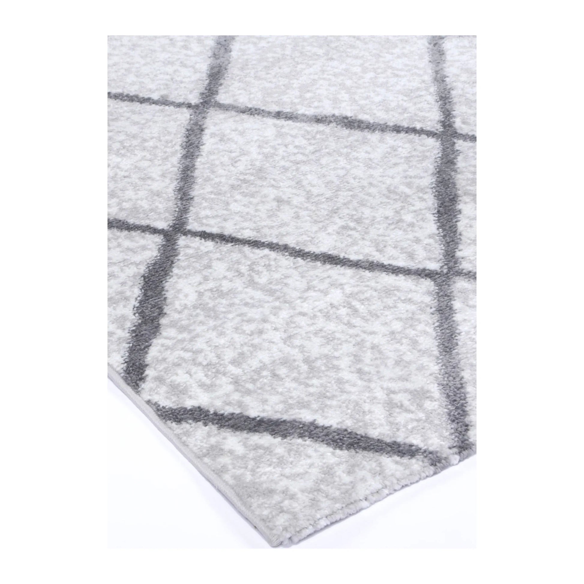 Corner detail of Kimberley 1 Trellis Silver rug showing bound edge, pile texture and diamond pattern, 290 x 200 cm