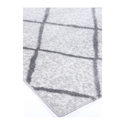 Corner detail of Kimberley 1 Trellis Silver rug showing bound edge, pile texture and diamond pattern, 290 x 200 cm