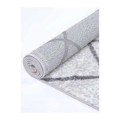 Rolled edge detail of Kimberley 1 Trellis Silver machine-made rug showing backing, binding and pile texture, 290 x 200 cm