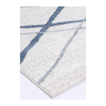 Corner detail of Kimberley 2 Blue Lattice rug showing bound edge, textured pile and modern geometric pattern, 230 x 160 cm