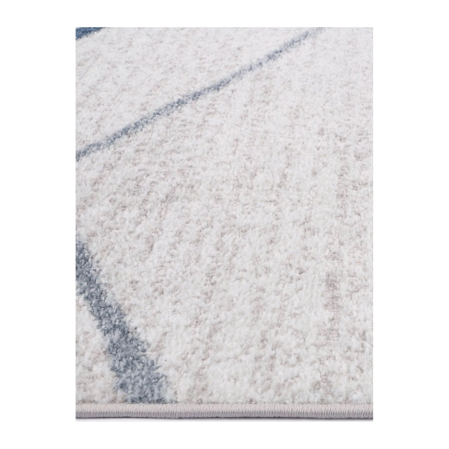 Edge detail of Kimberley 2 Blue Lattice rug showing soft pile texture, white field and blue line pattern, 230 x 160 cm