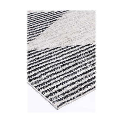 Corner detail of Kimberley 3 Diamond Charcoal rug showing bound edge, charcoal white pattern and textured surface, 230 x 160 cm