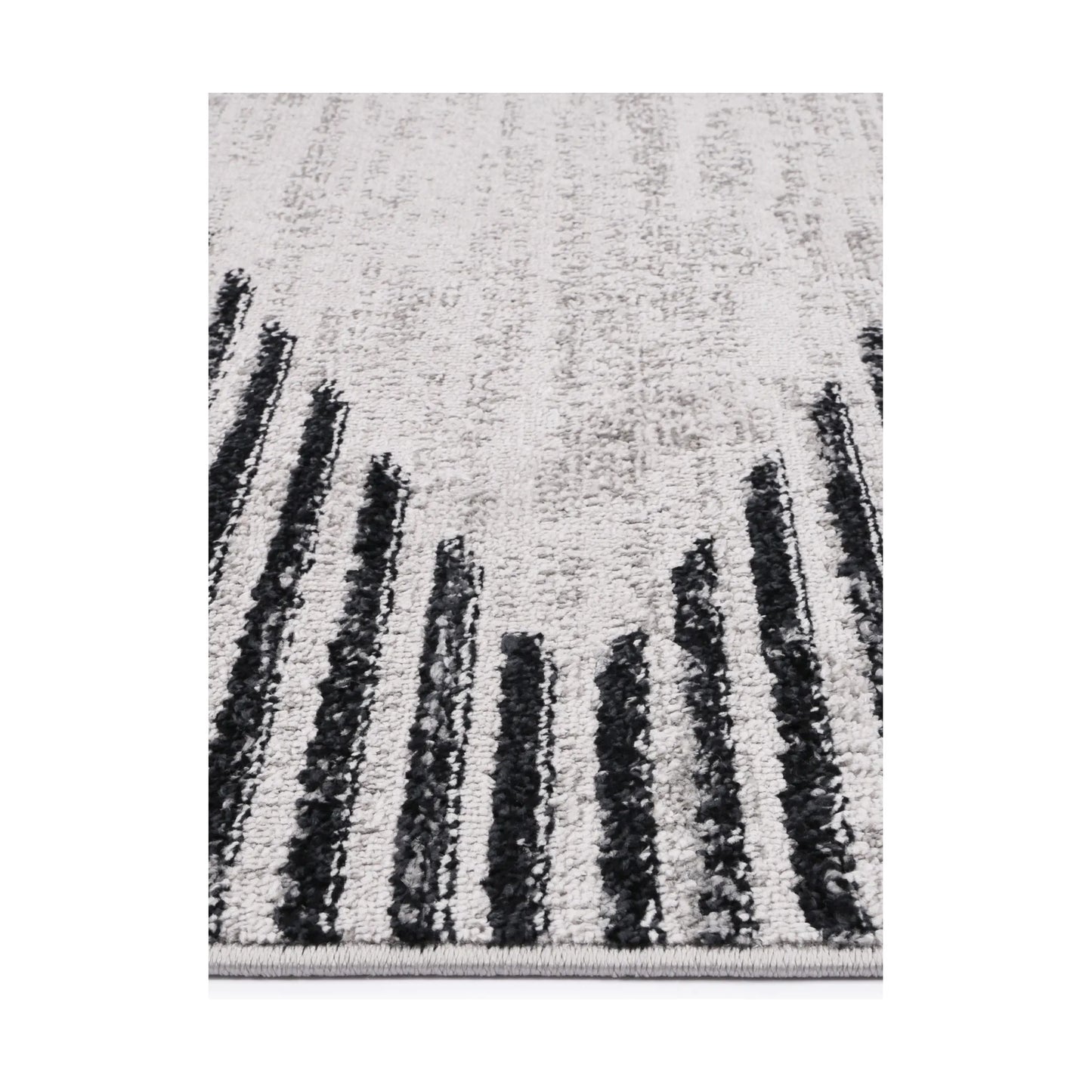 Edge detail of Kimberley 3 Diamond Charcoal rug showing heatset polypropylene pile, charcoal stripe detail and soft texture, 230 x 160 cm