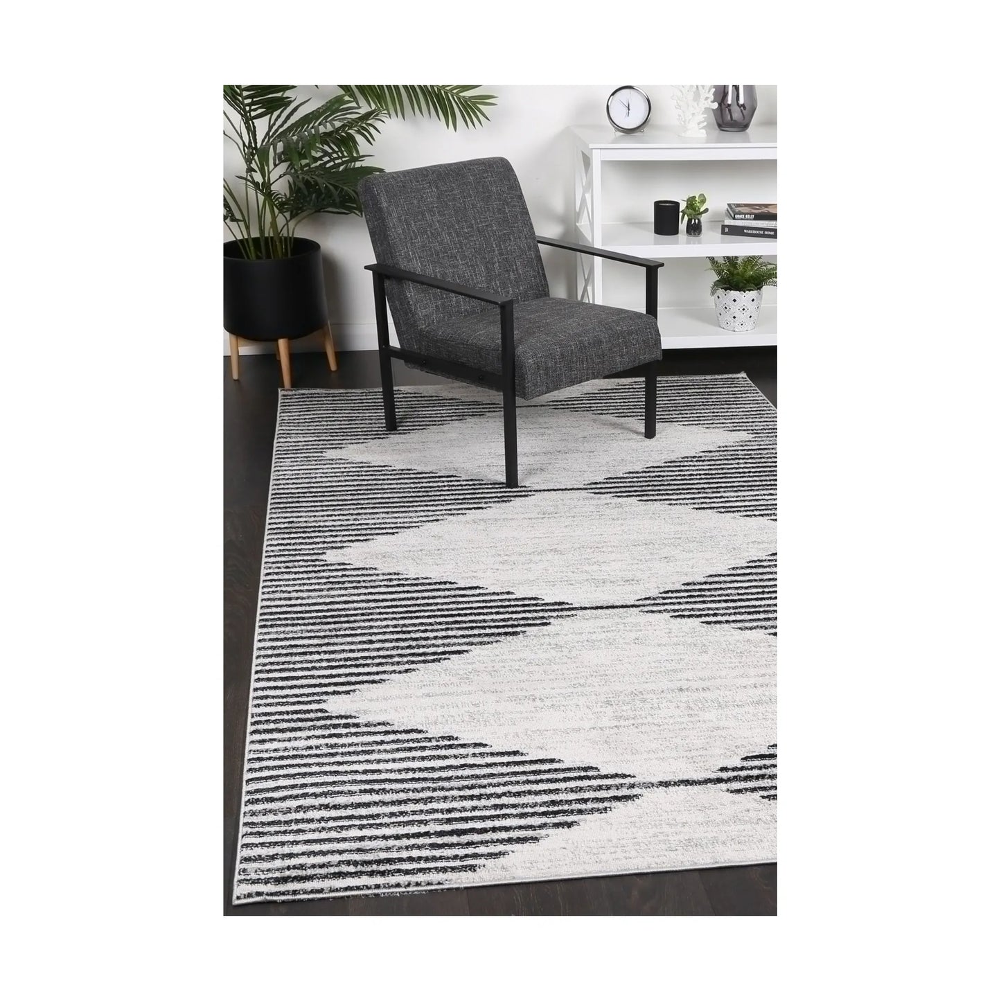 Kimberley 3 Diamond Charcoal rug styled with chair and indoor décor, showing modern charcoal white diamond design, 230 x 160 cm