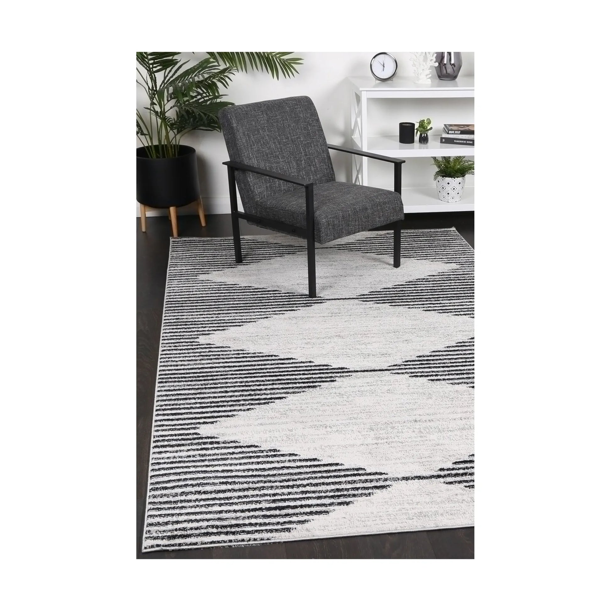 Kimberley 3 Diamond Charcoal rug styled with chair and indoor décor, showing modern charcoal white diamond design, 230 x 160 cm