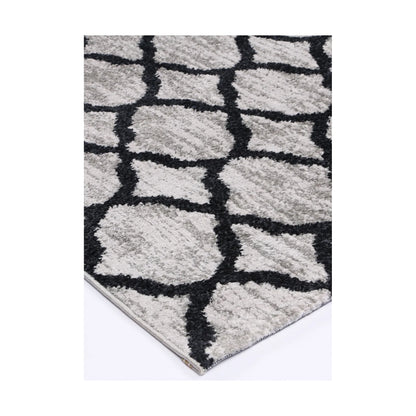 Corner detail of Kimberley 5 Repeat Charcoal rug showing bound edge, textured pile and modern lattice pattern, 230 x 160 cm