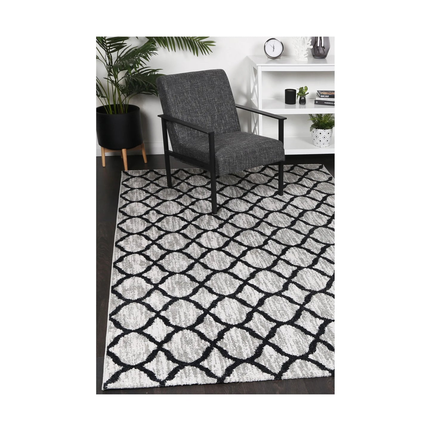 Kimberley 5 Repeat Charcoal rug styled with chair and indoor décor, showing modern charcoal grey lattice design, 230 x 160 cm