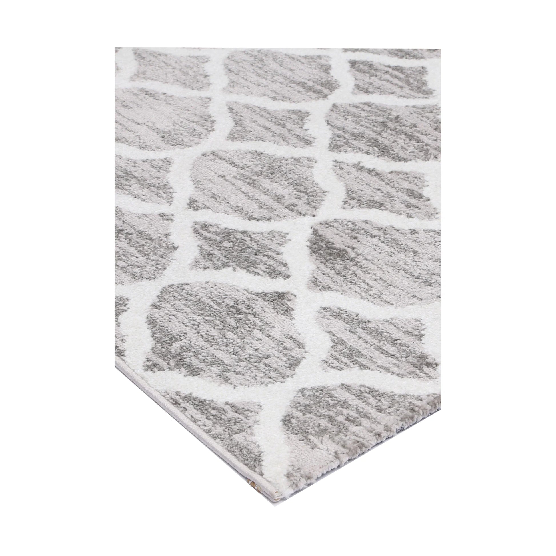Corner detail of Kimberley 5 Repeat Silver Rug showing silver-grey field and white pattern