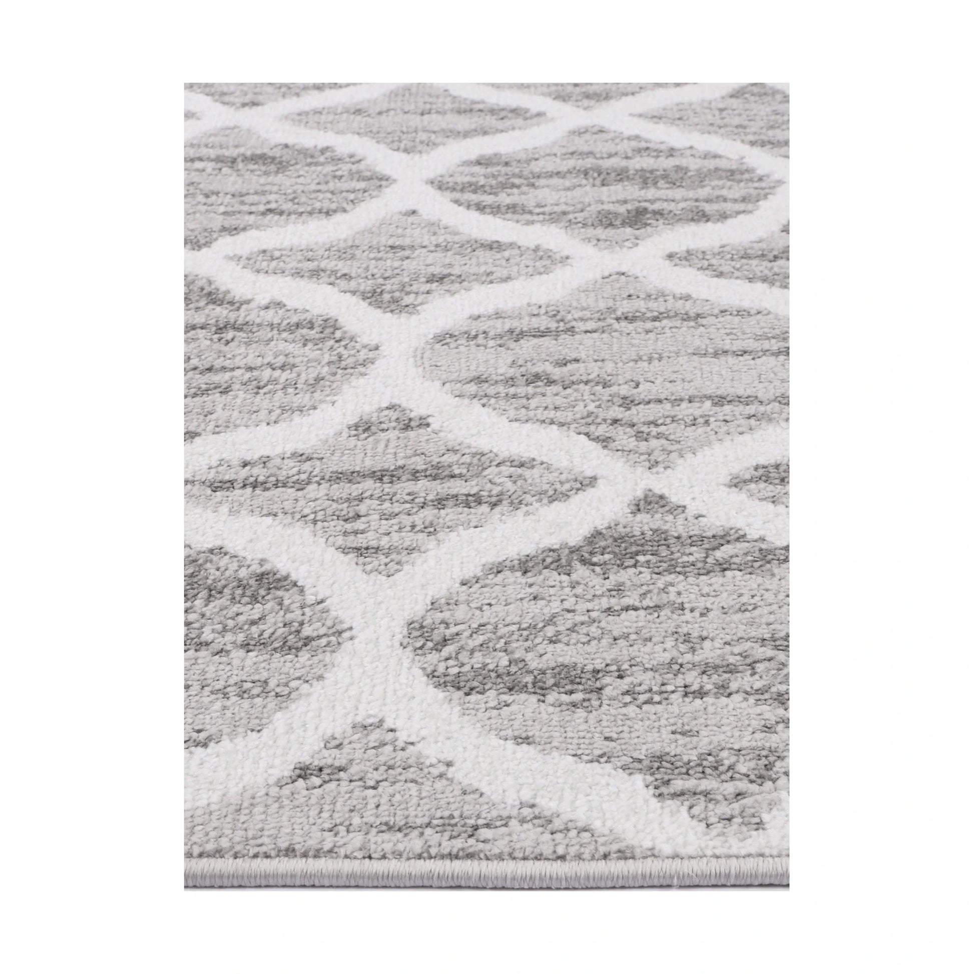 Edge texture detail of Kimberley 5 Repeat Silver Rug with raised white trellis design
