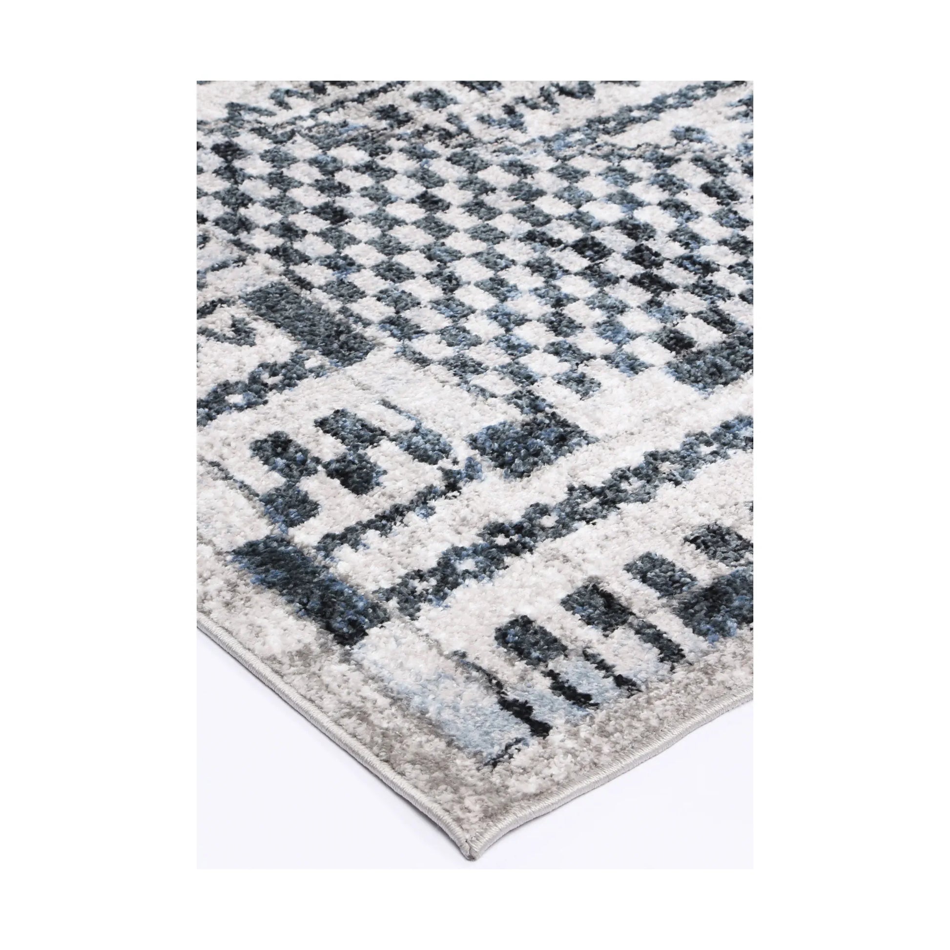 Corner detail of Kimberley 7 Aztec Blue rug showing geometric border, textured pile and modern pattern detail, 230 x 160 cm