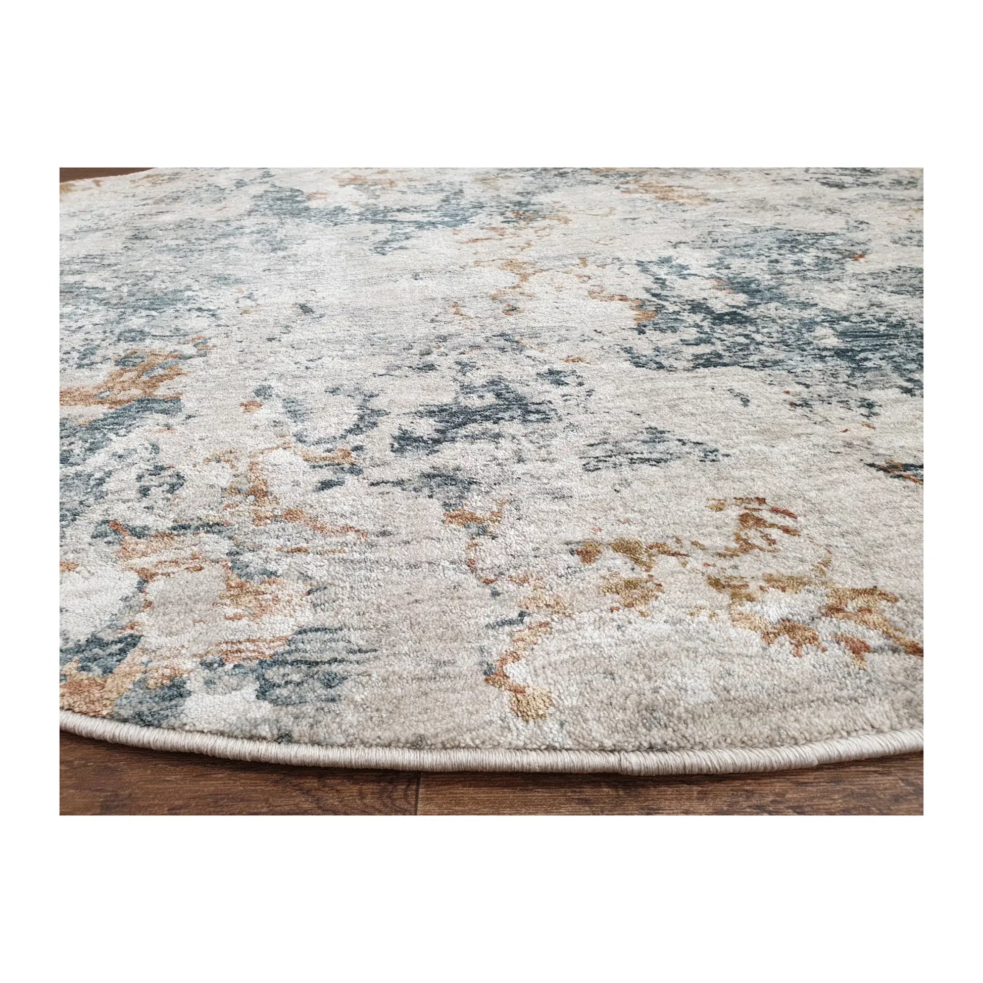 Low-angle close-up of light gray round rug showing surface texture and abstract design, 160 cm