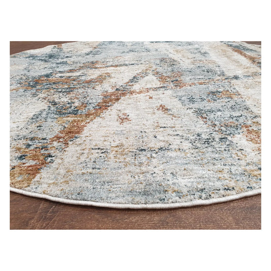 Angled detail of light grey round rug showing abstract pattern and edge finish, 160 cm