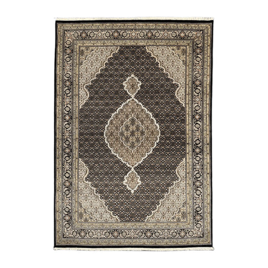 Full view of Mahi Tabriz hand-knotted wool rug with deep brown-black field, ornate central medallion and layered beige borders, 295 x 196 cm