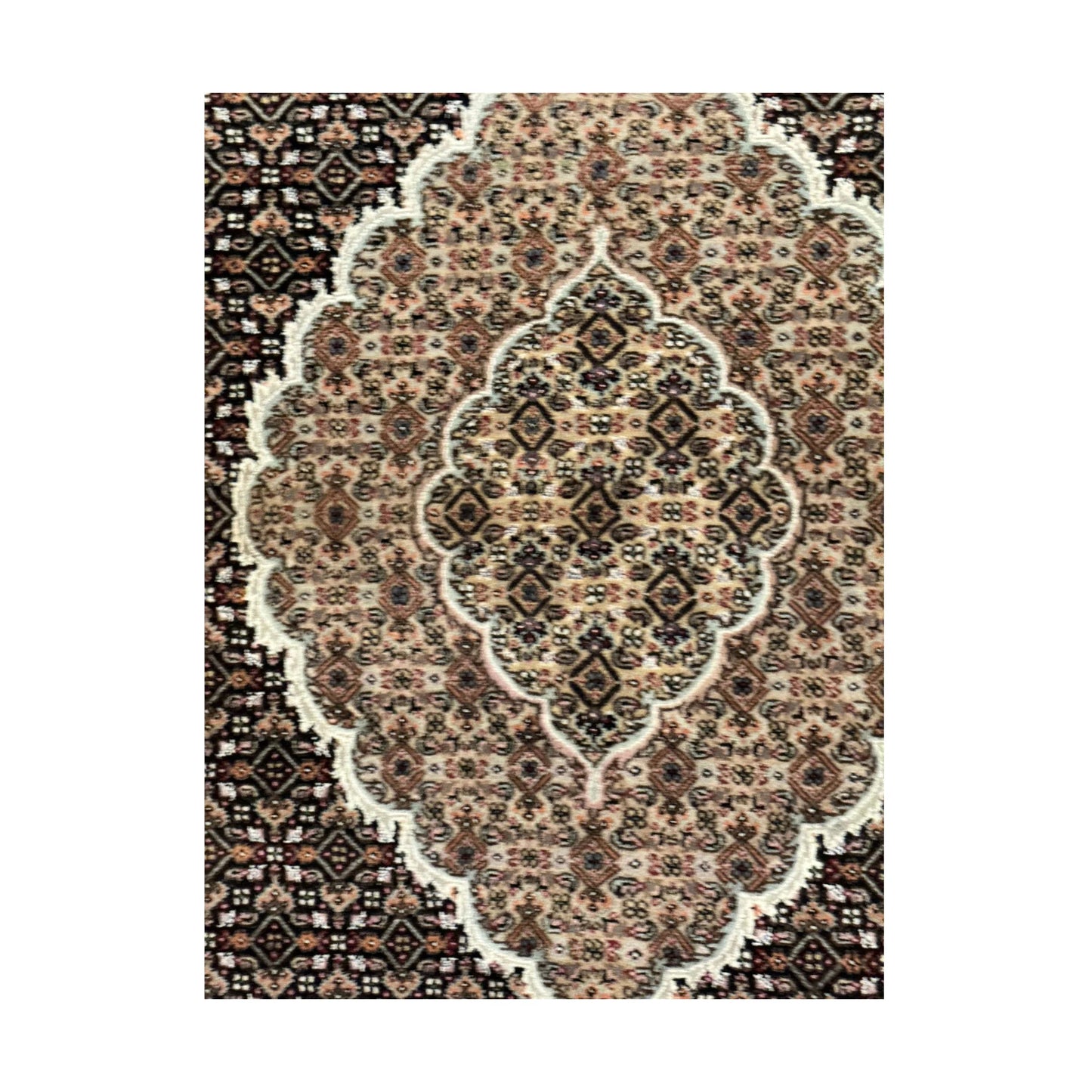 Close-up of Mahi Tabriz rug showing the ornate central medallion and fine floral lattice pattern