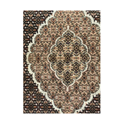 Close-up of Mahi Tabriz rug showing the ornate central medallion and fine floral lattice pattern