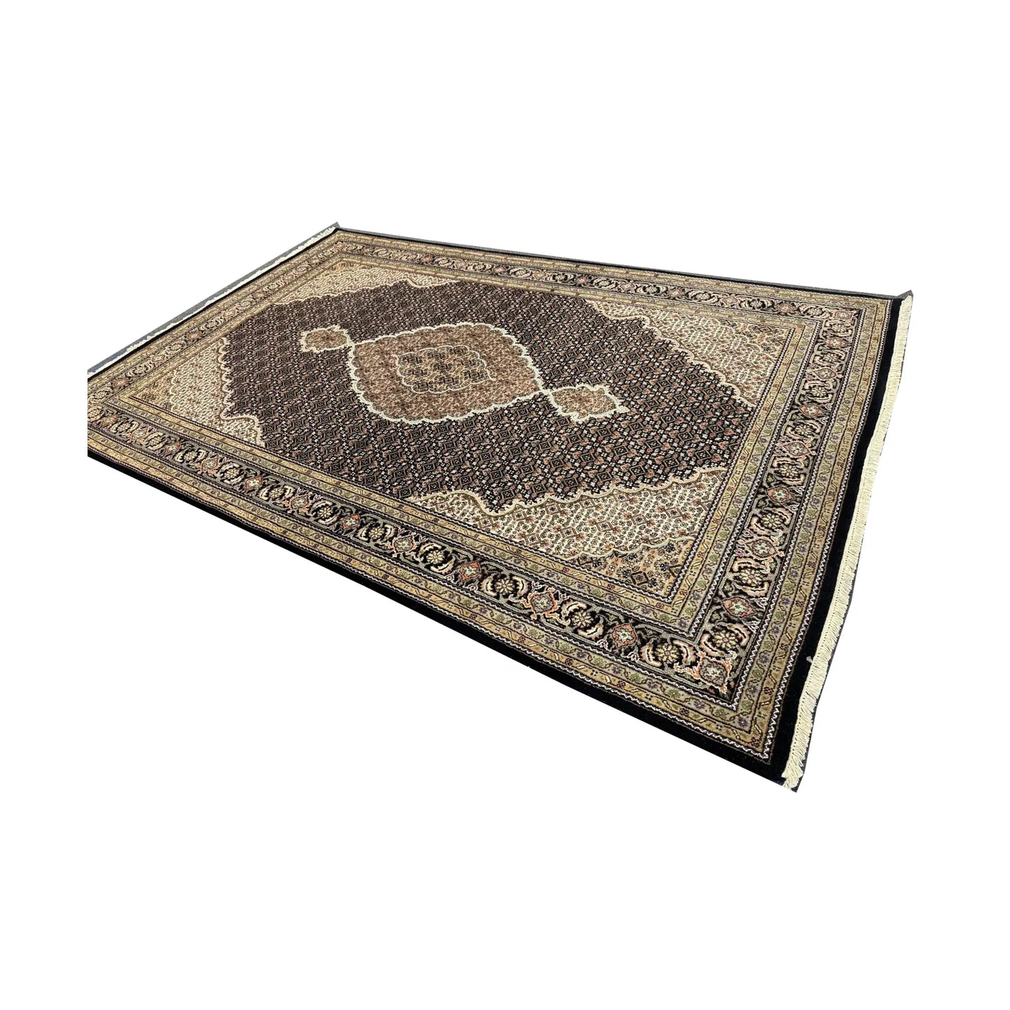 Showroom angled full view of Mahi Tabriz rug showing the dramatic dark field, medallion and layered beige border