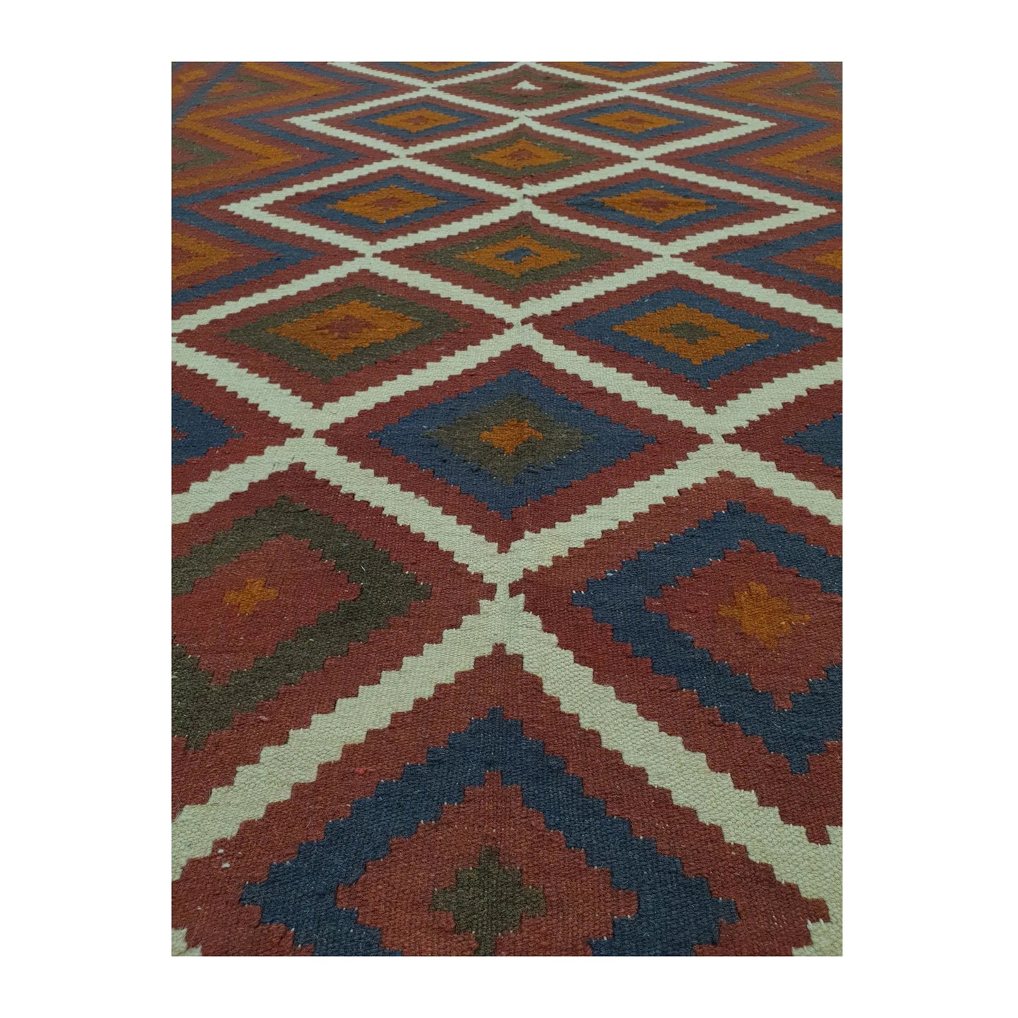 Geometric field detail of Mamina Kilim wool rug with stepped diamond motifs and flatwoven wool texture, 239 x 169 cm