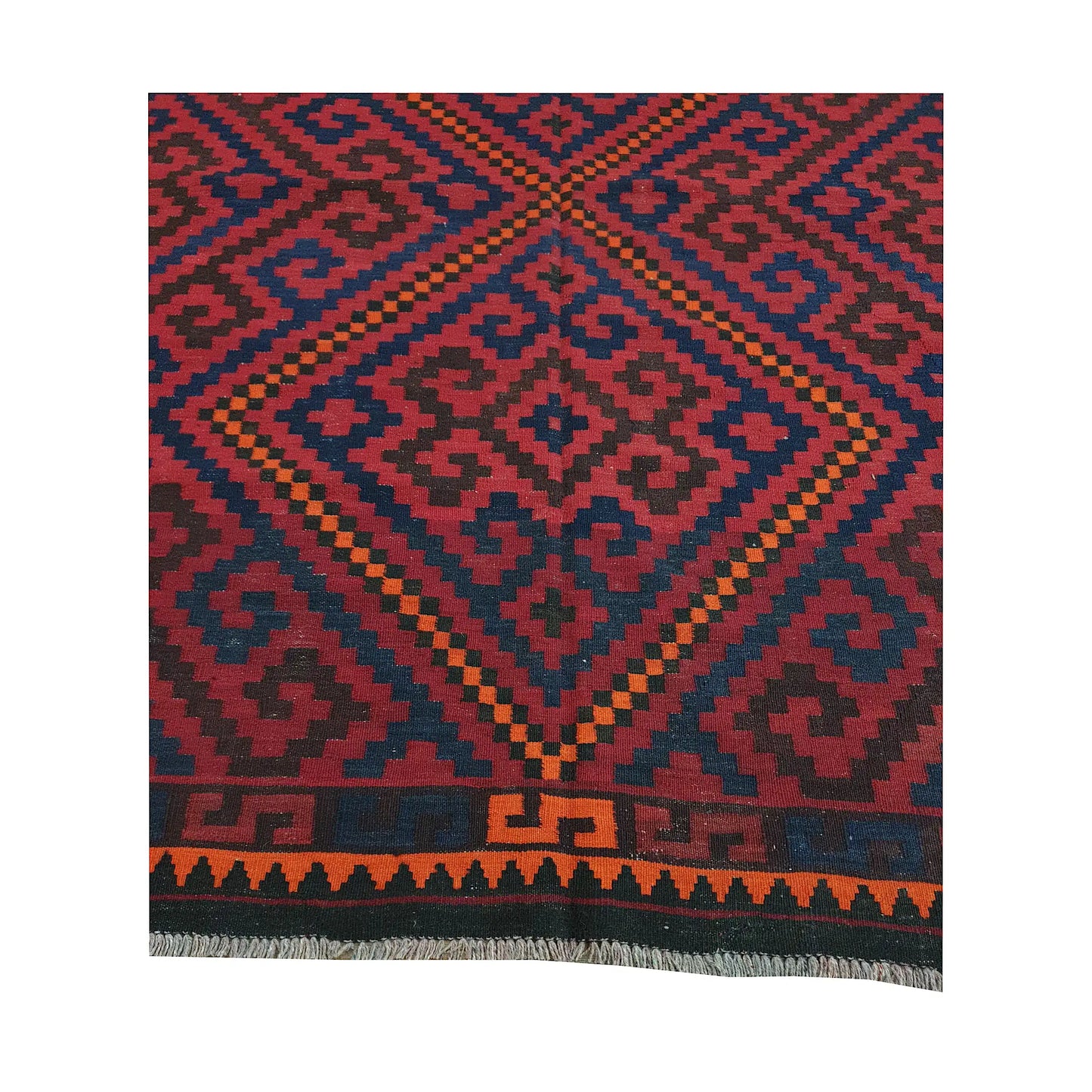 Geometric medallion and border detail of Mamina Kilim wool rug showing stepped tribal motifs and orange edging