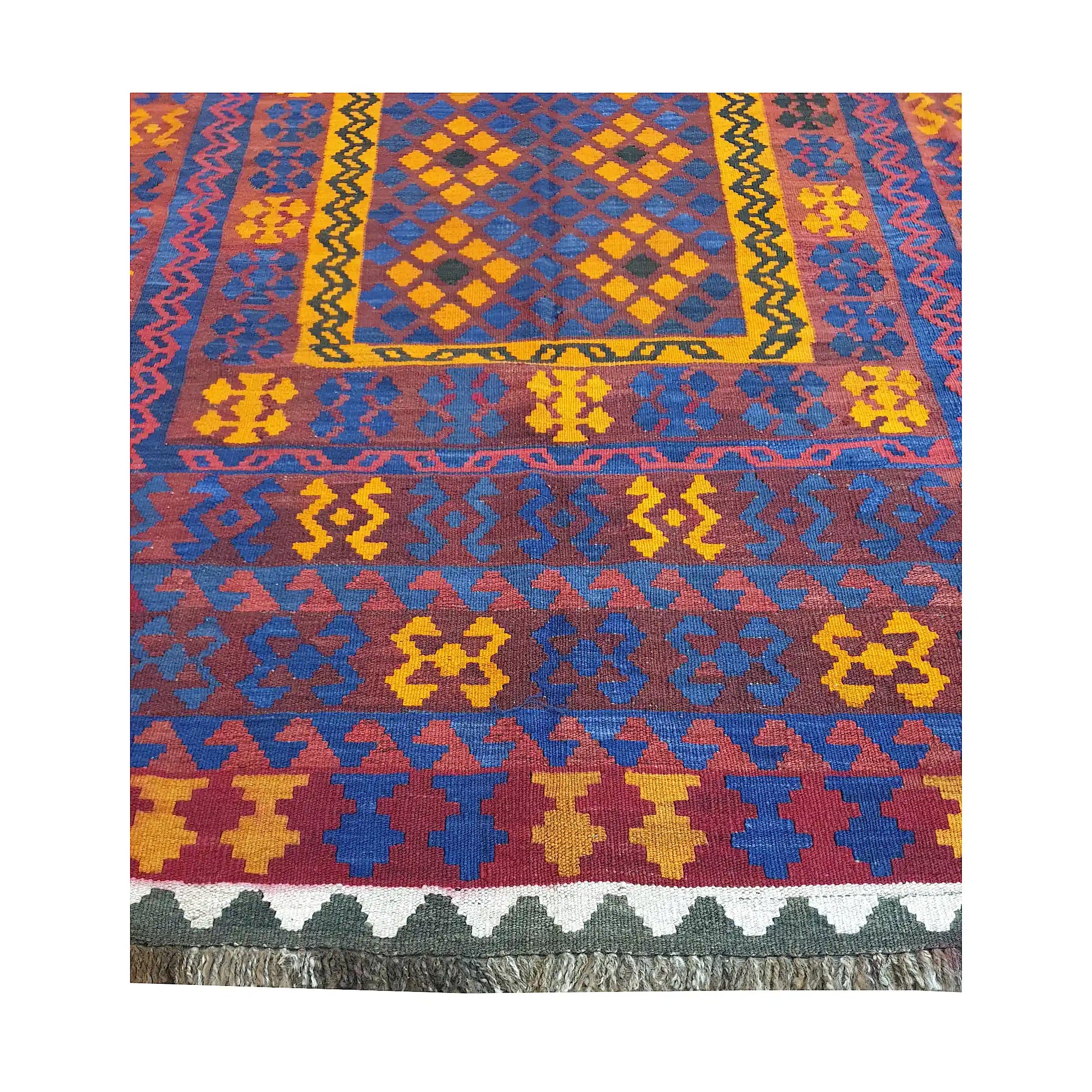 Central panel and border detail of Mamina Kilim wool rug showing yellow diamond motifs and multicolour kilim pattern