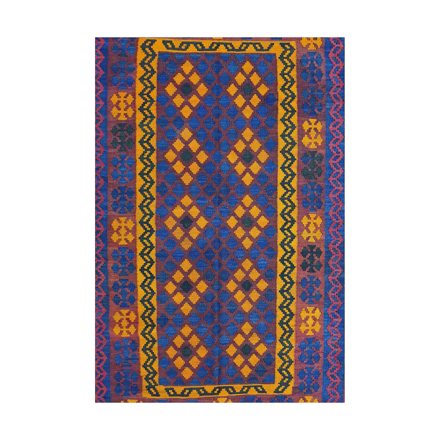 Close-up of Mamina Kilim wool rug showing purple blue geometric field with yellow, orange and red border details