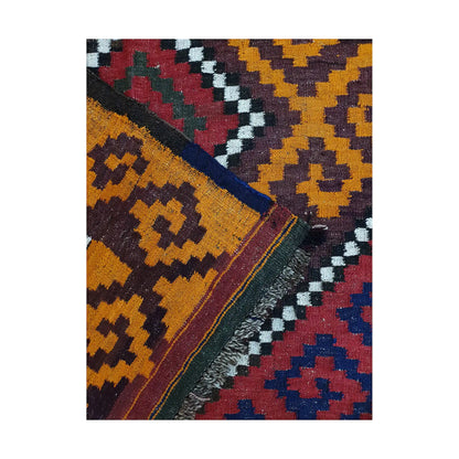 Folded corner flatweave detail of Mamina Kilim wool rug showing layered border colours and handwoven texture