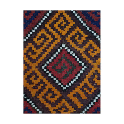 Close-up of Mamina Kilim wool rug showing mustard diamond medallion pattern with burgundy, navy and ivory accents