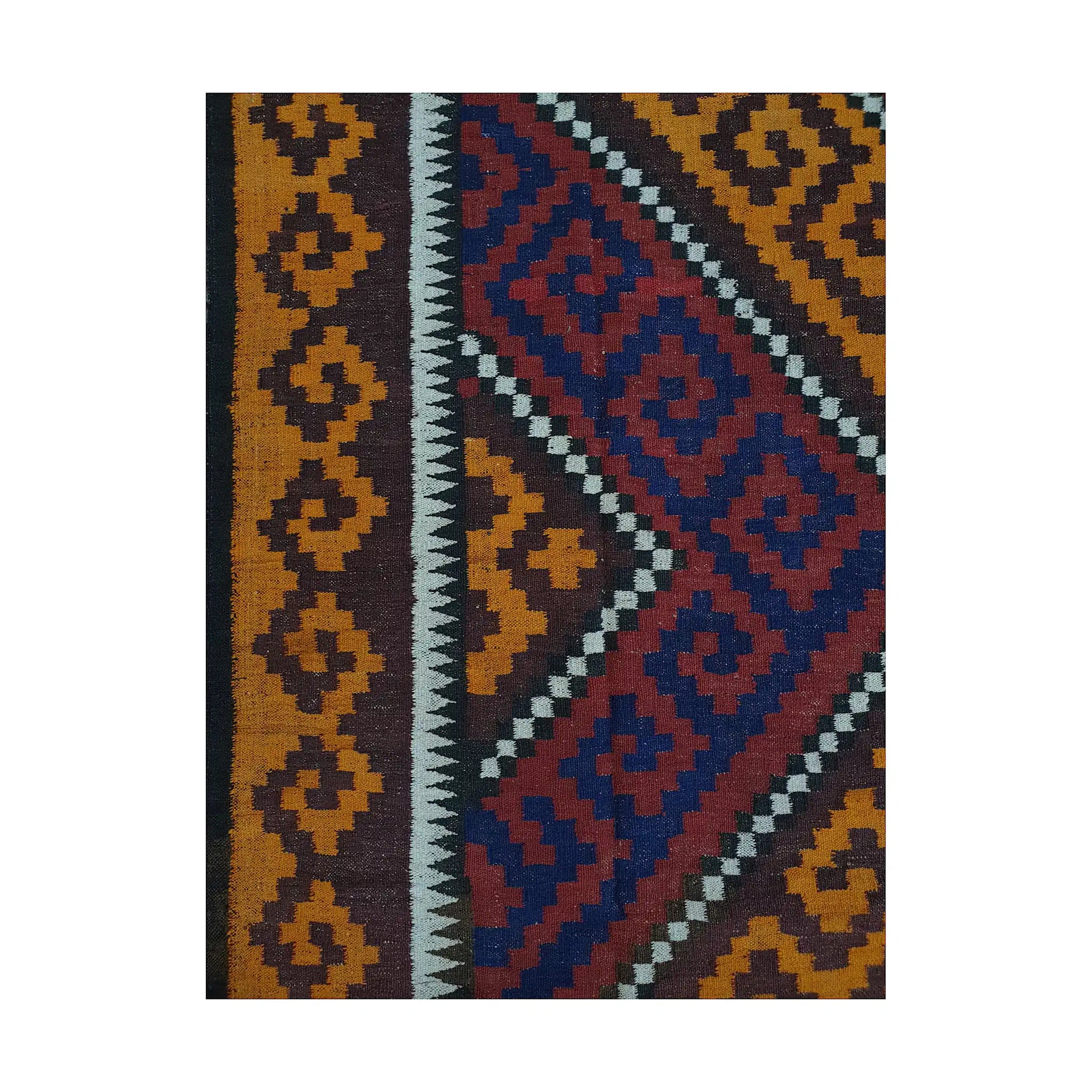 Side border pattern detail of Mamina Kilim wool rug showing mustard border, dark edging and stepped geometric motifs