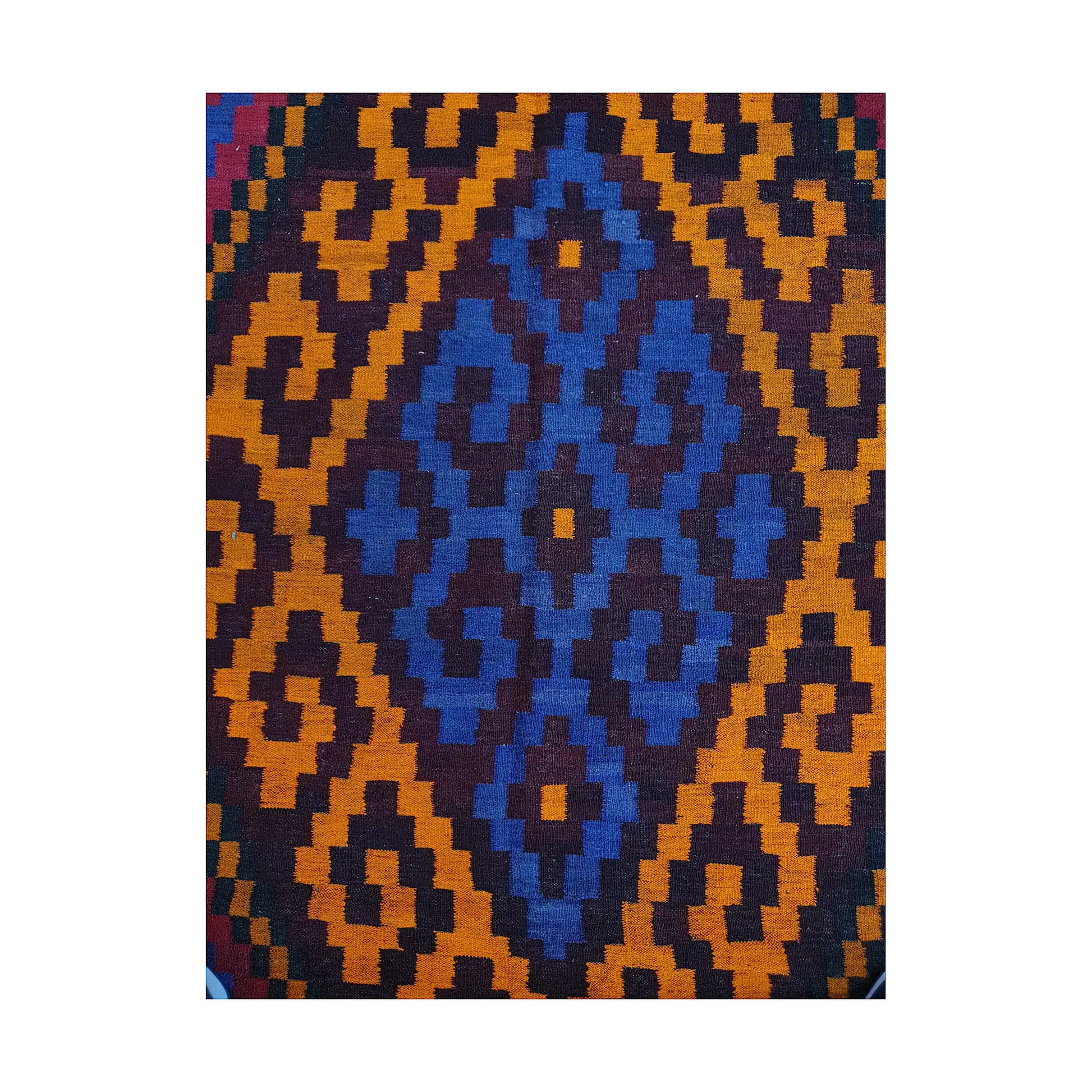 Blue centre diamond close-up of Mamina Kilim wool rug with gold geometric border and dark flatwoven detail
