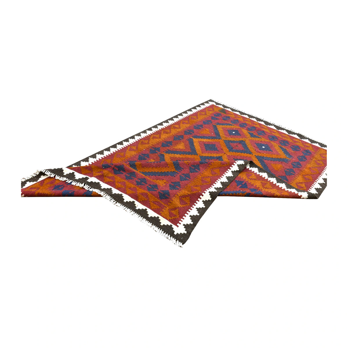 Folded view of Mamina kilim showing its red and orange diamond field, contrasting ivory and dark brown border and turned corners