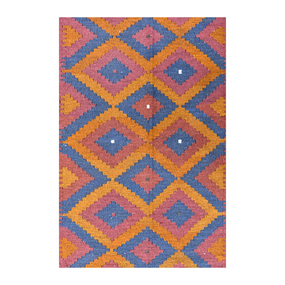 Close-up of Mamina kilim showing stepped slate-blue diamonds, burnt orange bands, muted red centres and small ivory accents
