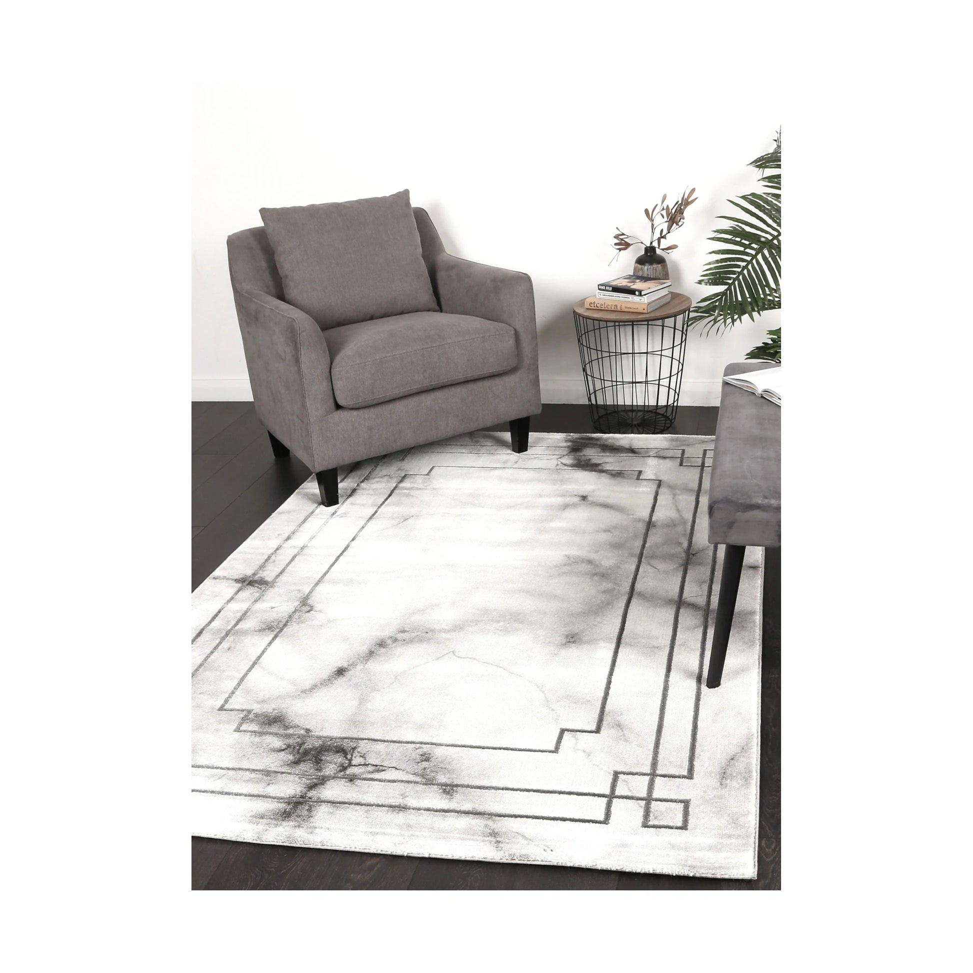 Modern Antep Grey Designer Rug styled in a contemporary lounge setting