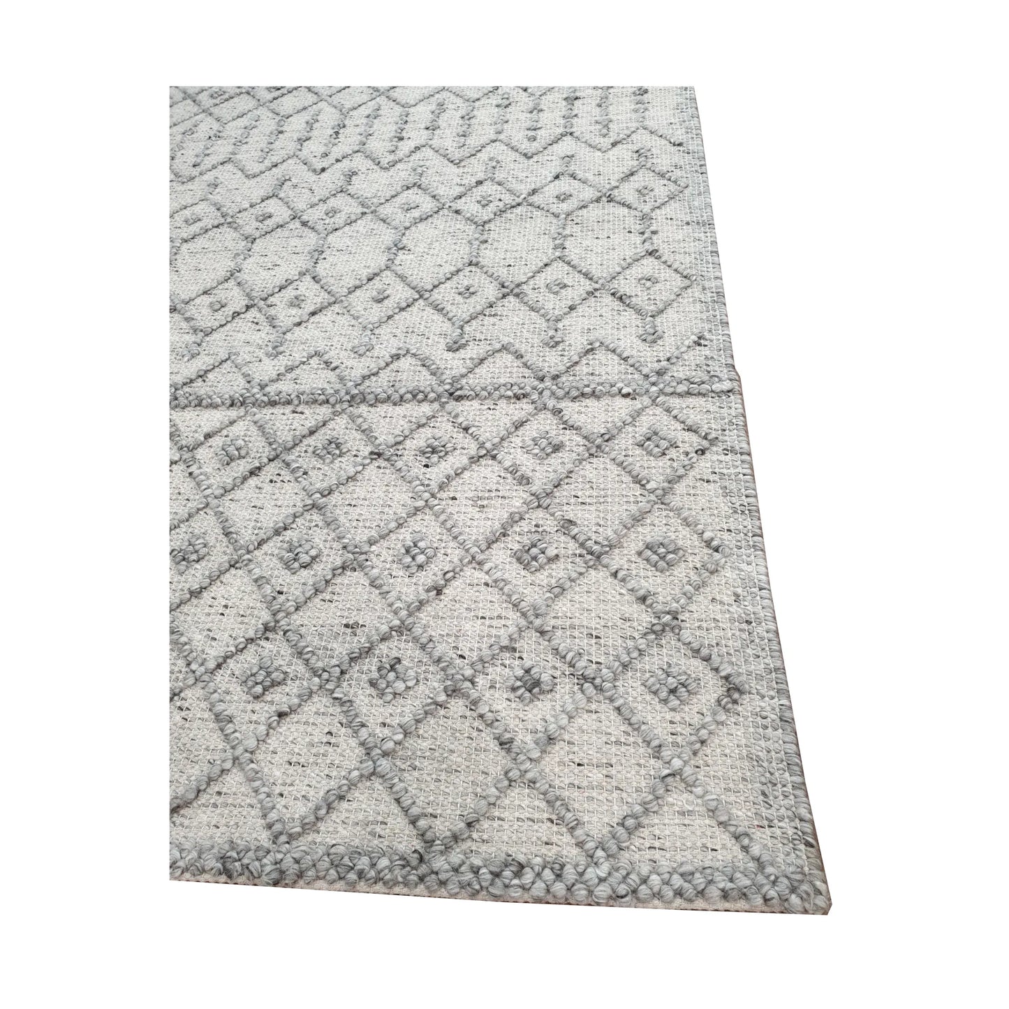 Border and edge detail of modern grey wool rug showing geometric diamond pattern and woven texture
