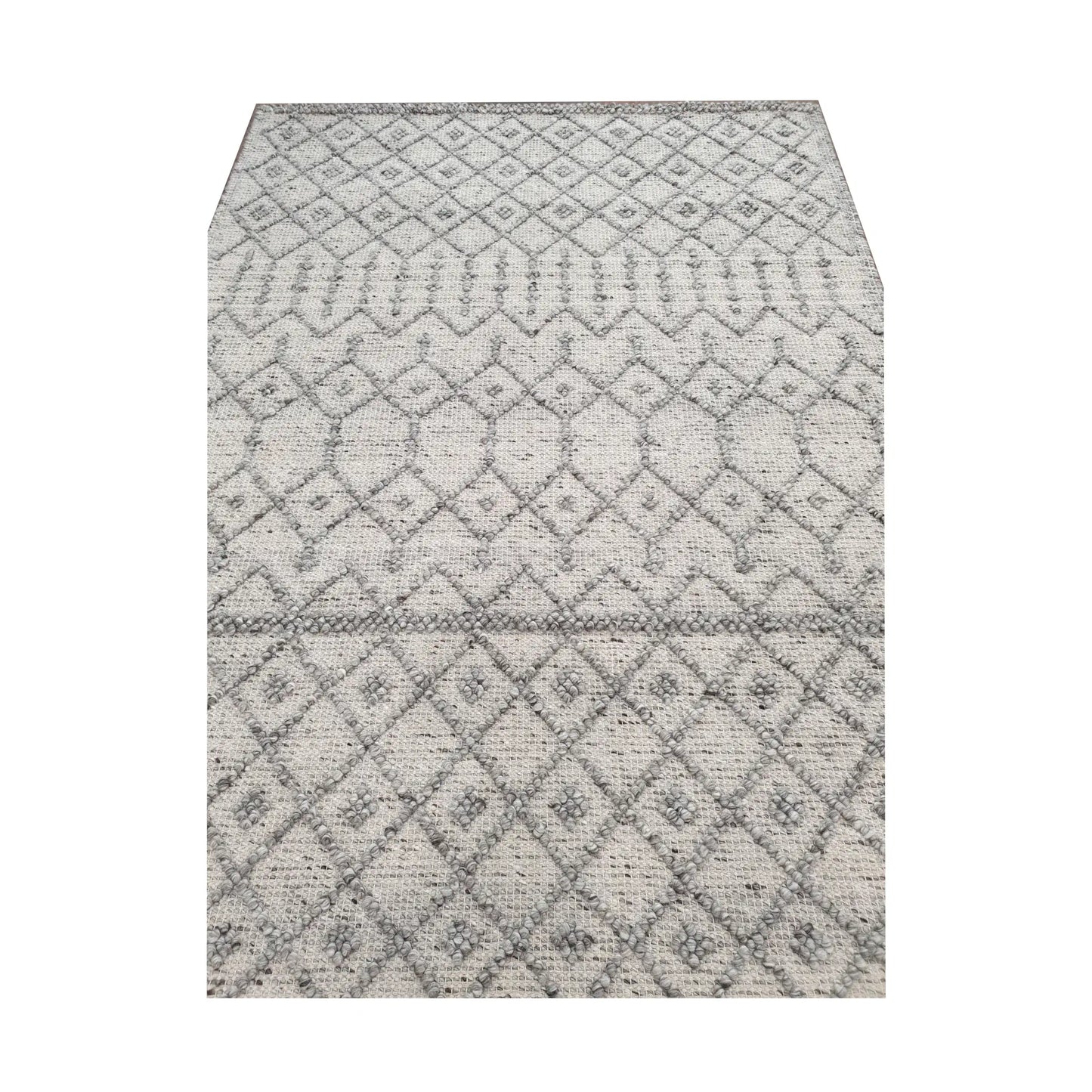 Close-up of modern grey geometric wool rug showing ivory diamond pattern and soft woven surface