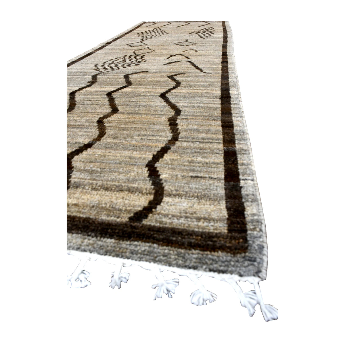Angled view of Moroccan wool runner showing its natural textured field, dark brown border, wavy linework and white tasselled fringe