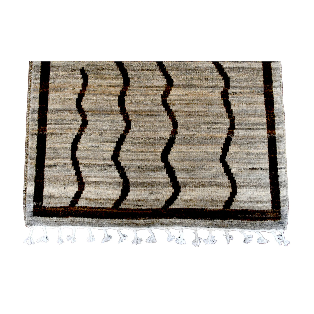 Fringe-end detail of Moroccan runner showing irregular brown wavy lines, a rectangular border and white tassels