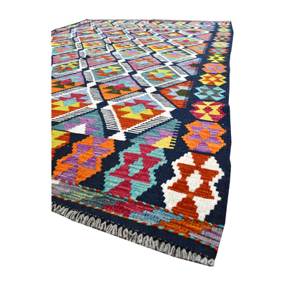 Angled detail of Afghan Chobi kilim showing multicoloured border motifs, ivory diamond outlines and pale fringe