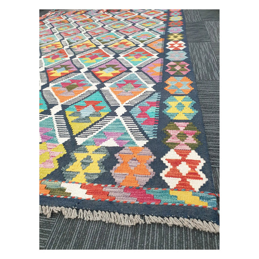 Angled detail of Afghan Chobi Kilim showing fringe, border motifs, and handwoven flatweave texture, 248 x 172 cm