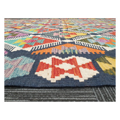 Low-angle close-up of Afghan Chobi Kilim showing wool flatweave texture and geometric tribal pattern, 248 x 172 cm