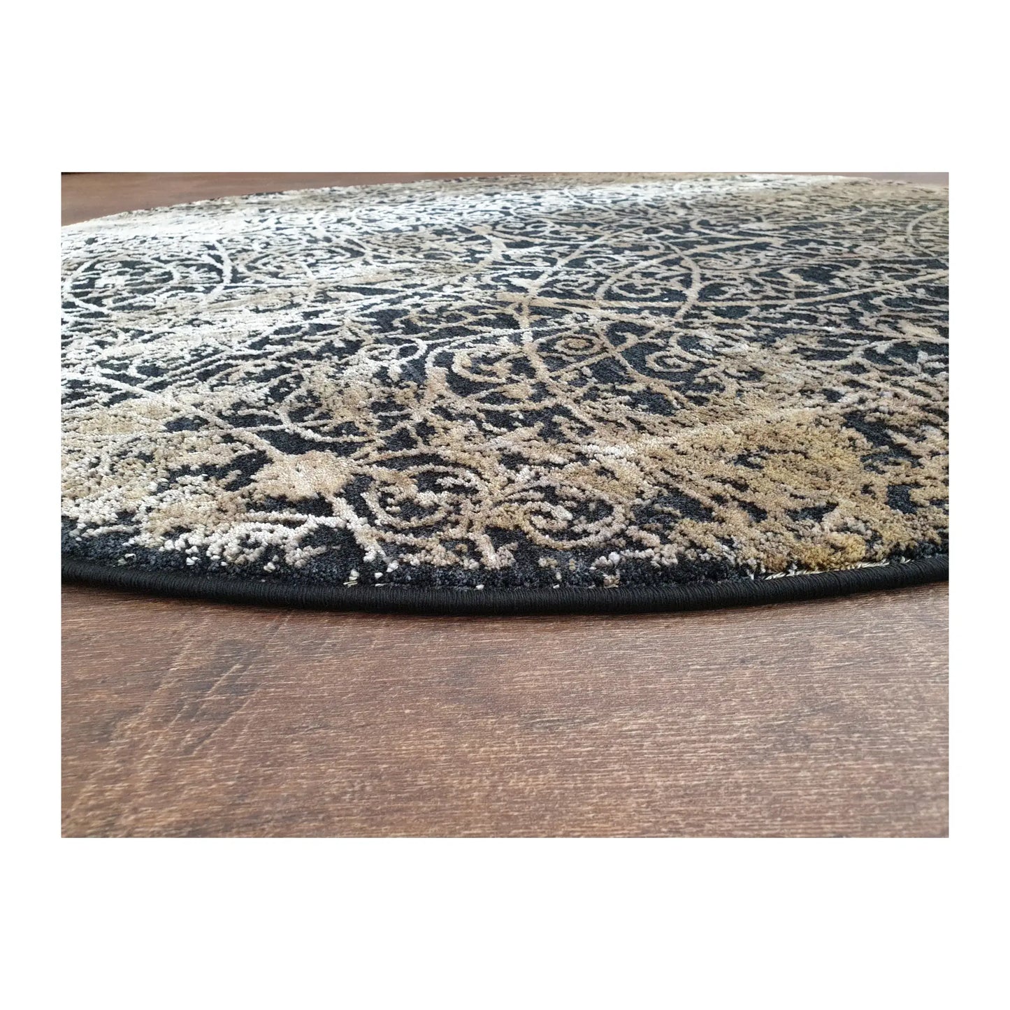 Low-angle close-up of navy and beige round rug showing surface texture and patterned finish, 160 cm
