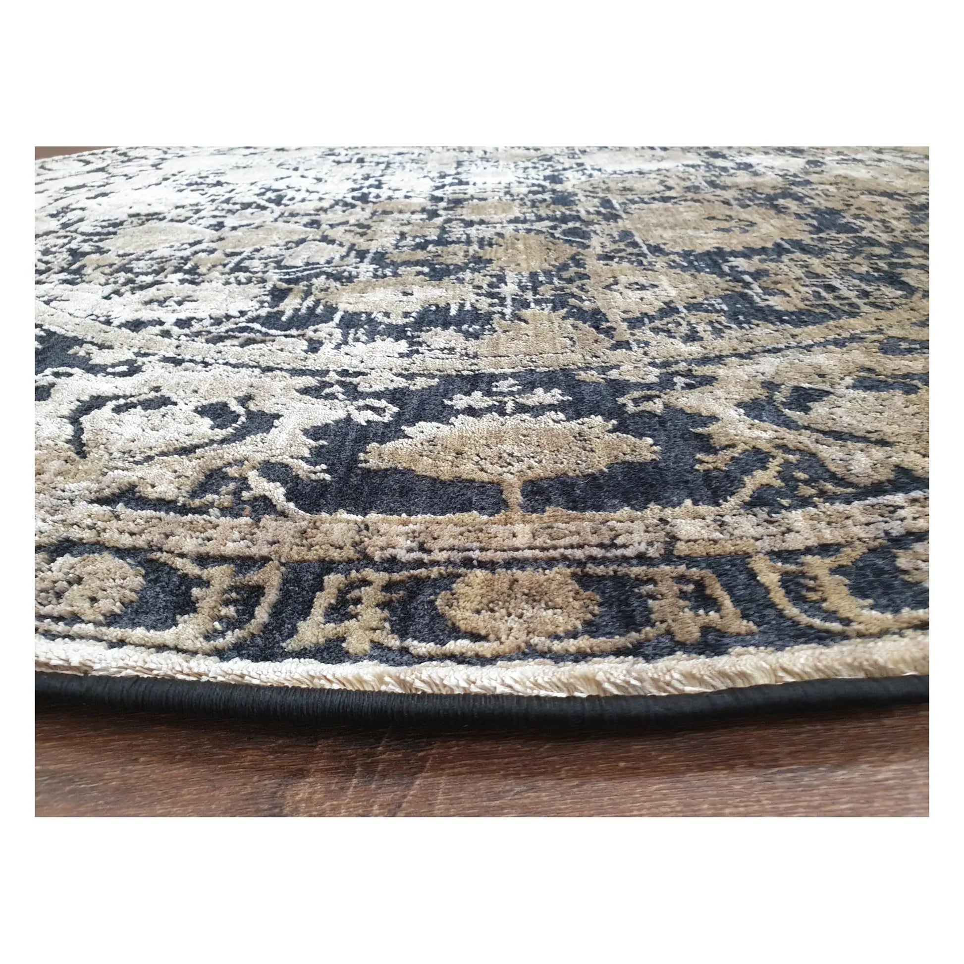 Low-angle close-up of round rug showing surface texture and worn-look medallion design, 160 cm