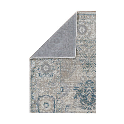 Folded reverse backing detail of Oporto Antwerp Cream & Blue Traditional Rug showing grey backing and cream-blue patterned surface, 230 x 160 cm
