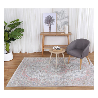 Styled room view of Oporto Bremen Blush & Blue Traditional Rug with soft medallion design and neutral lounge setting, 290 x 200 cm