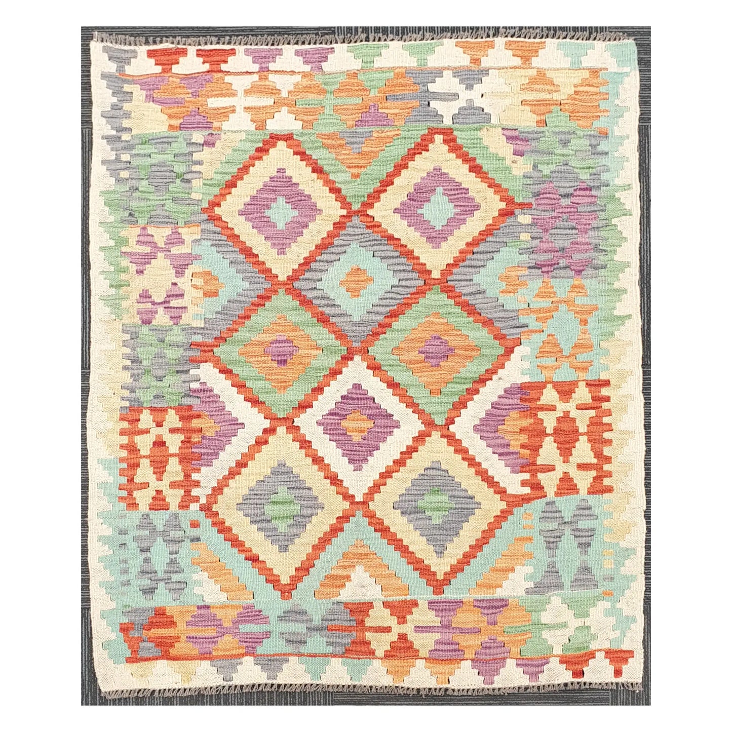Full view of Afghan Chobi Kilim rug with pastel diamond lattice field on an ivory ground, 133 x 100 cm