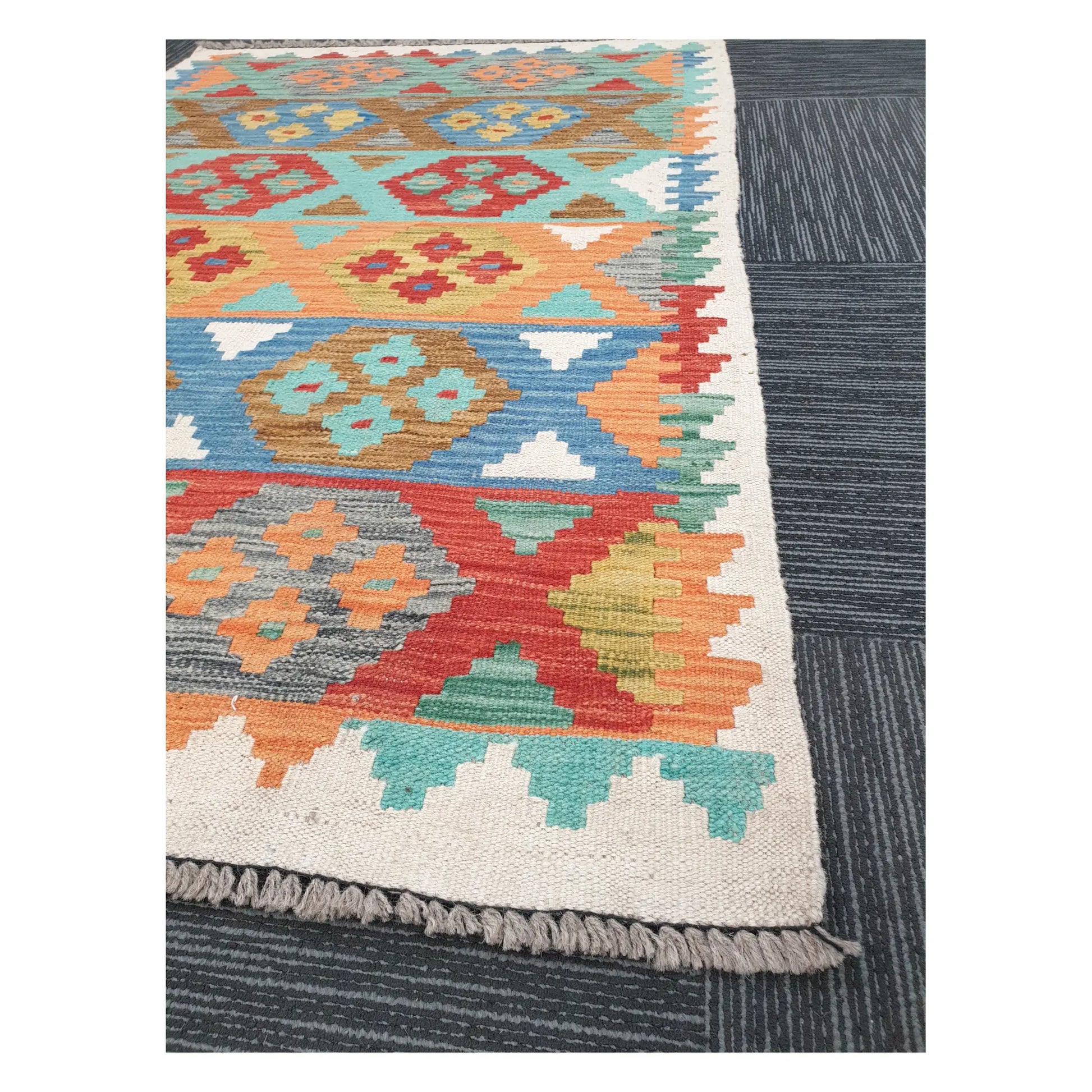 Angled detail of Afghan Chobi Kilim showing fringe, border pattern, and handwoven flatweave texture, 150 x 103 cm