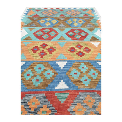 Close-up of Afghan Chobi kilim showing paired stepped medallions across aqua, blue, peach and terracotta bands