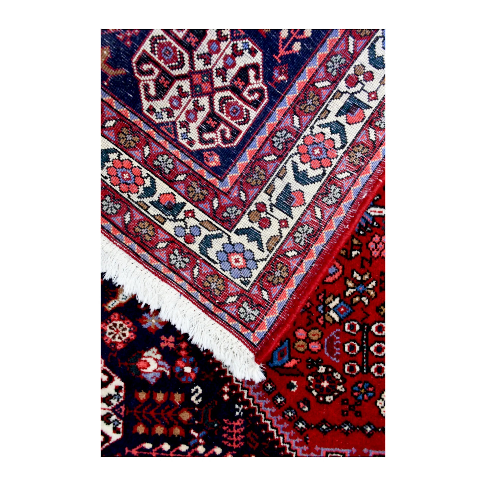 Reverse-weave detail of Persian Abadeh hand-knotted wool rug showing the back structure, pattern and weave