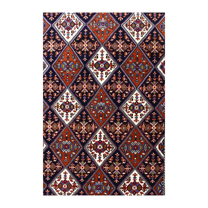 Field detail of Persian Afshar rug showing a repeating diamond lattice in dark navy, rust red and ivory